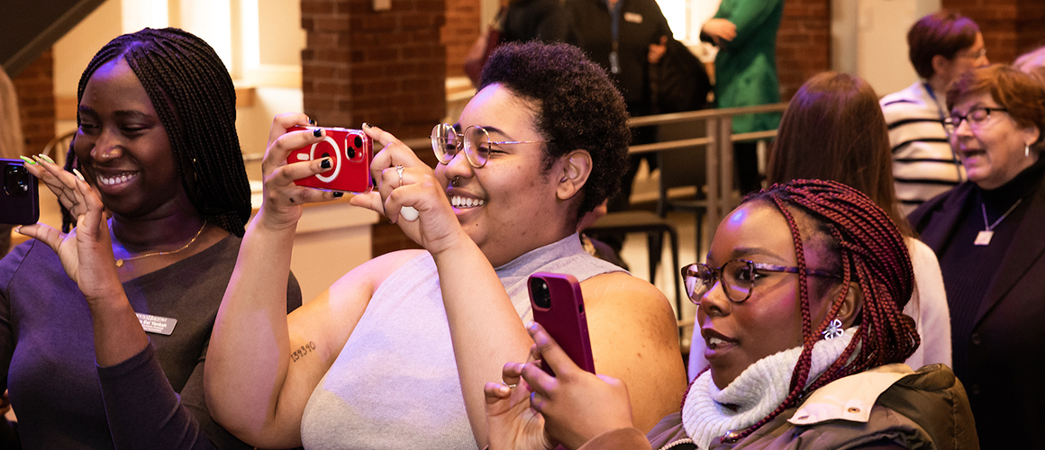 Students snapping photos during the President-elect announcement event