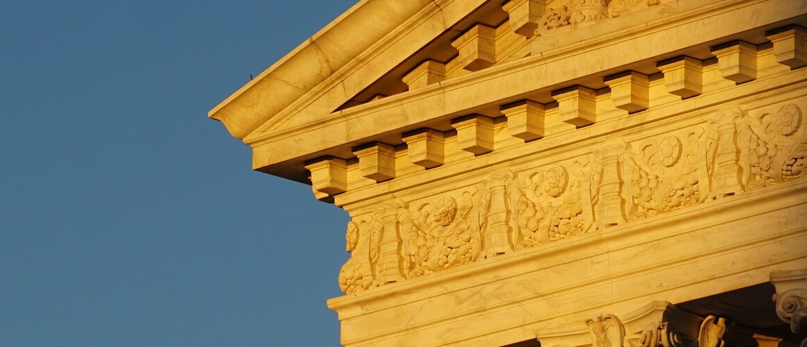 An image of the Supreme Court in the fading sunlight.