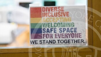 Sign on door that reads "Diverse, Inclusive, Accepting, Welcoming, Safe Space for Everyone, we stand together".