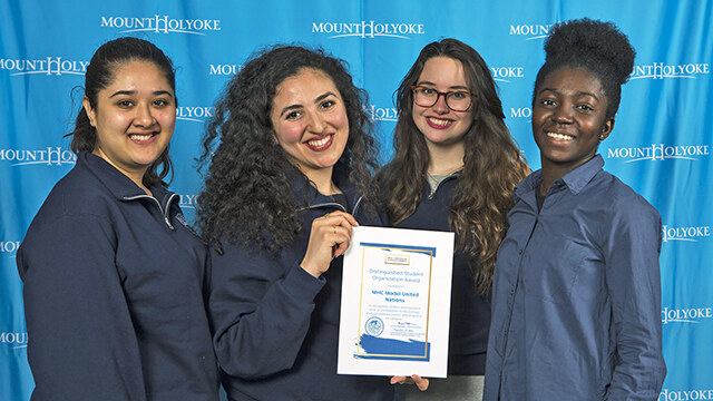 Board members of the Mount Holyoke Model United Nations pose with their Distinguished Student Organization Award citation (from left): Maham Khan ’19, Marwa Mikati ’17, Kim Foreiter ’19 and Edith Amoafoa-Smart ’19.