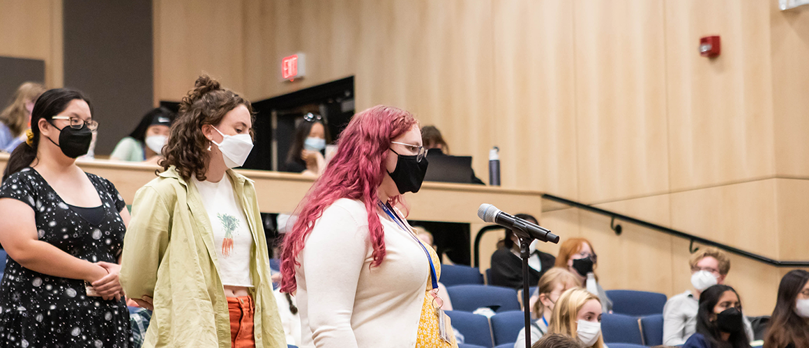 Students preparing to ask questions at the After Roe panel discussion
