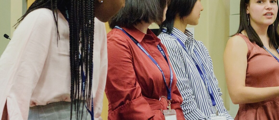 Students presenting information at a scholarship conference at Mount Holyoke College