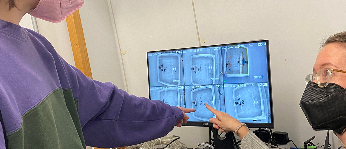 Jenny VanWyk works with a student on her research