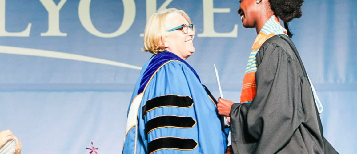 President Sonya Stephens awards Donari Yahzid her degree at Commencement 2019