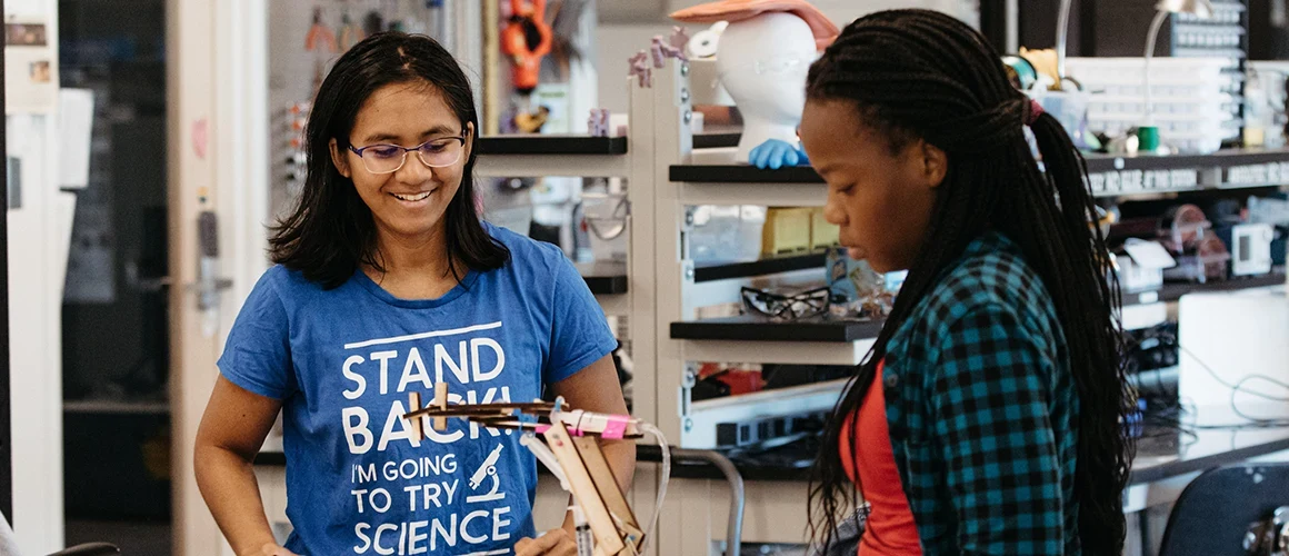 Students in a science lab working on a project together at Mount Holyoke College.
